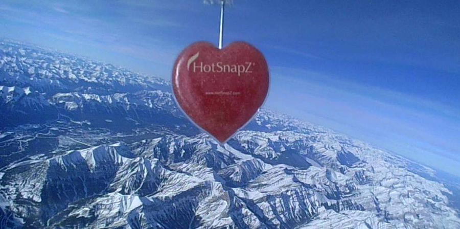Heart-shaped HotSnapZ hand warmer over the Rockies